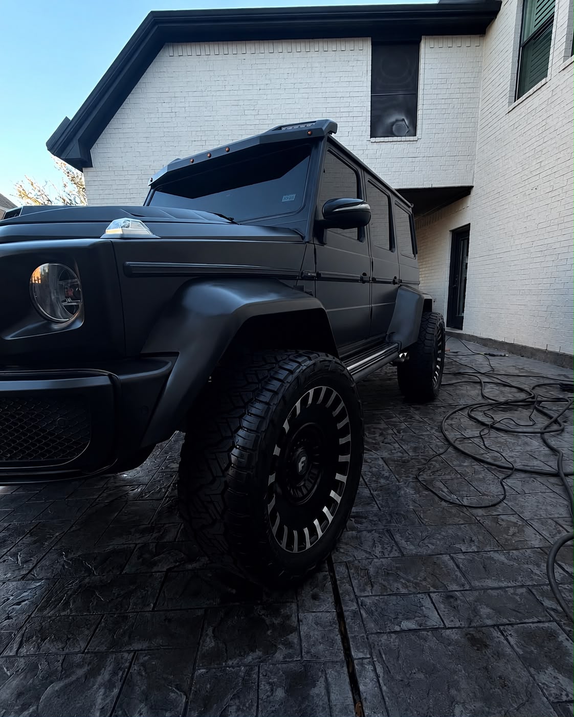 Close-up matte black Brabus style G-Wagon after detailing