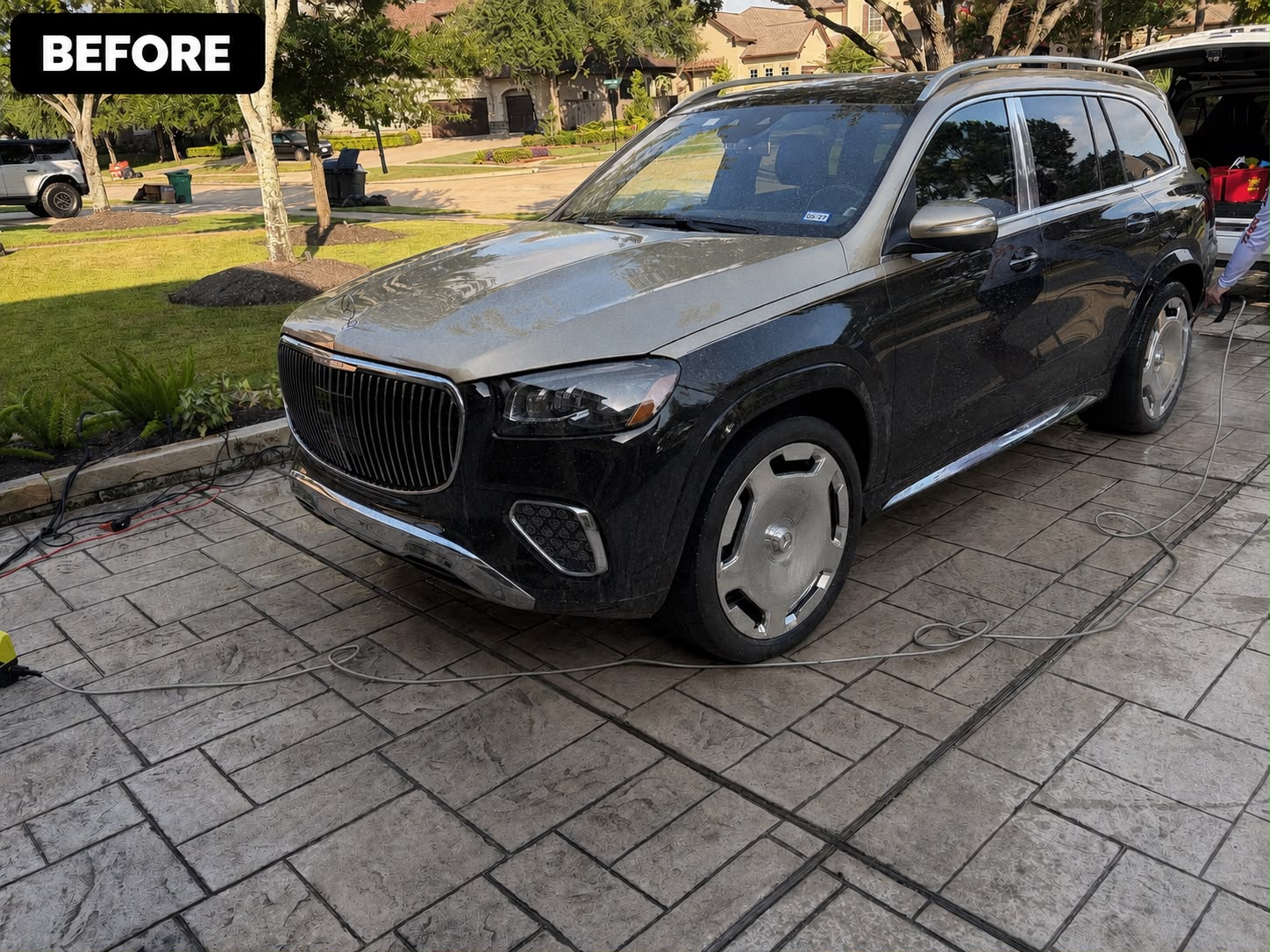 Glossy black luxury SUV after detailing